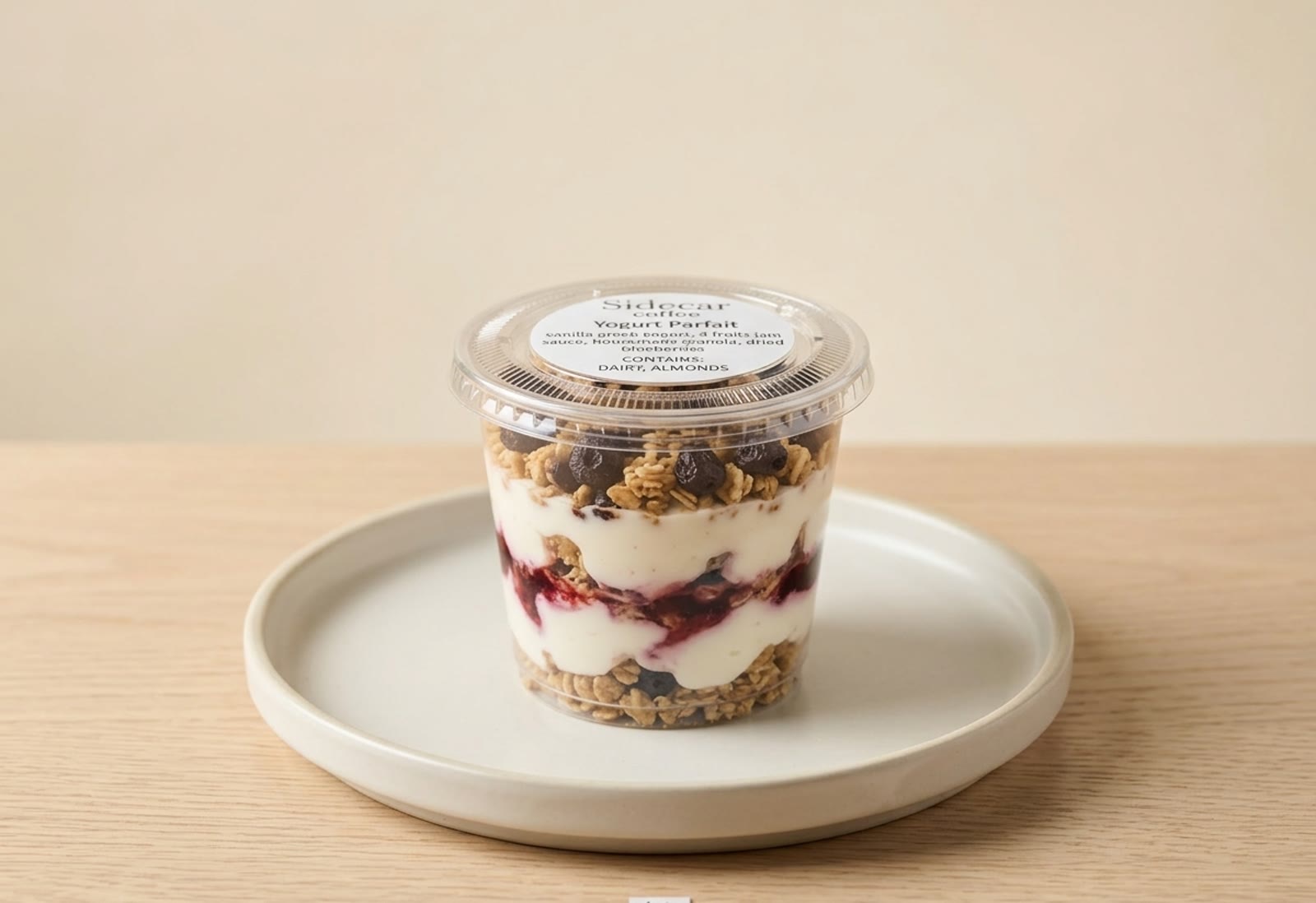 Yogurt parfait jar on a Hasami plate